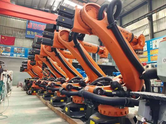 KUKA использовало робототехнический шкаф управлением руки KR210 C4 регулируя штабелирующ нагружать штемпелюющ высекать